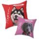 Two red and light pink custom pet remembrance pillows with pet portrait and halo ring, close-up view